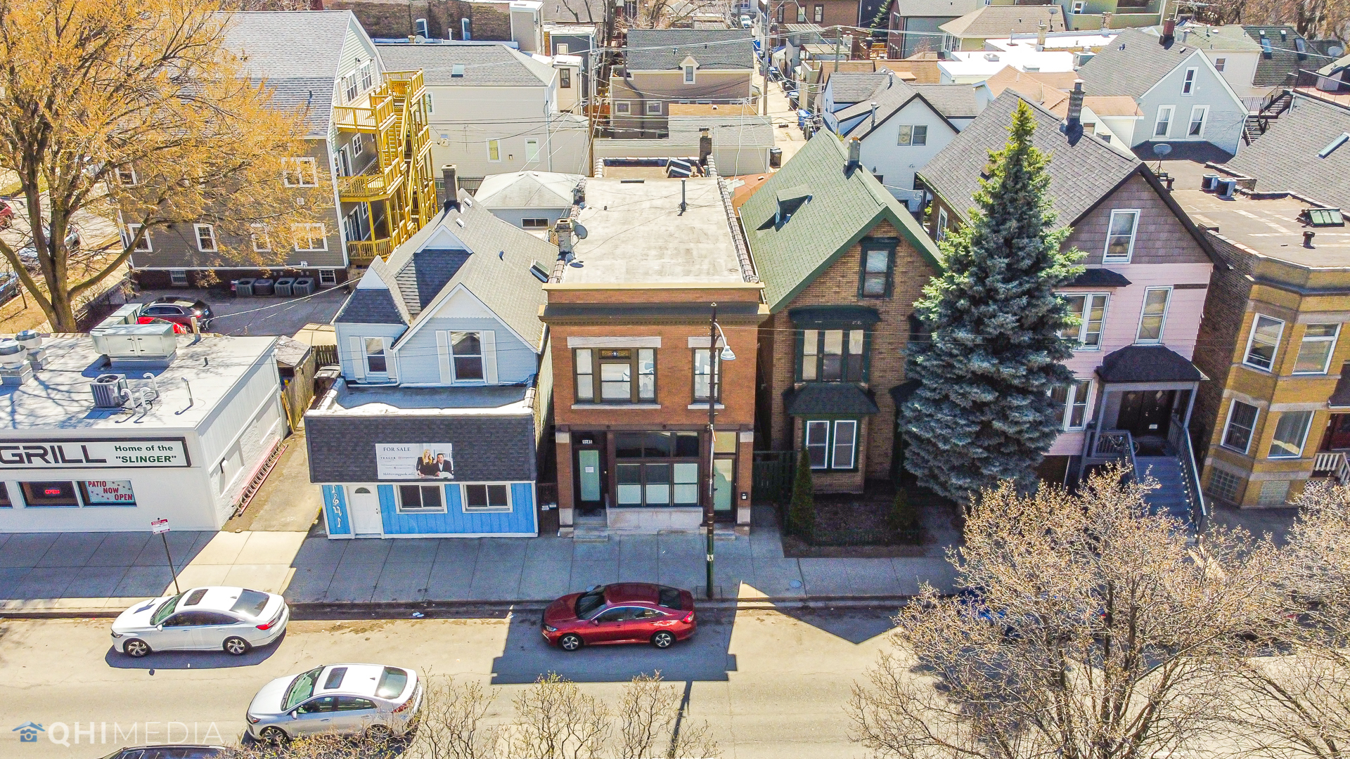 1645 West Irving Park Road Chicago, IL 60613 - Photo 30 of 33 a front view of a building with parking space