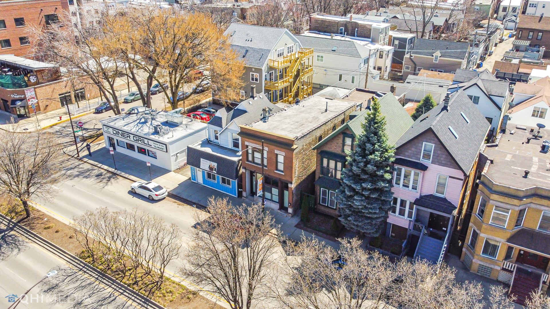 1645 West Irving Park Road Chicago, IL 60613 - Photo 31 of 33 a view of residential houses with car parked