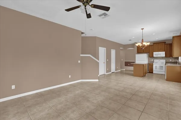 a view of a kitchen with a sink and a cabinet a fire place