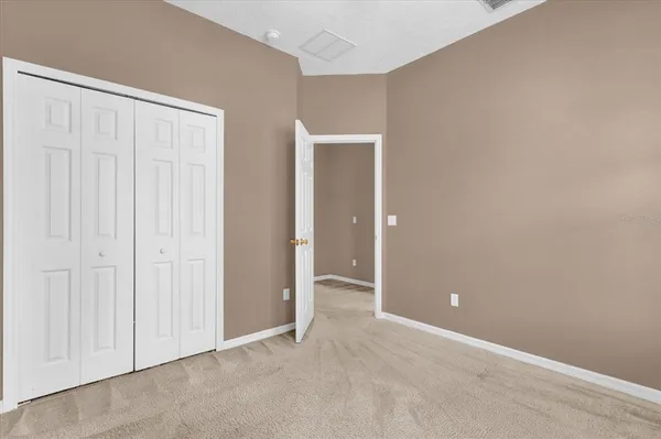 an empty room with closet area