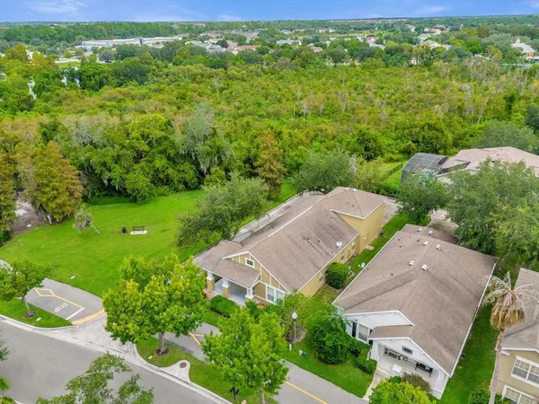 an aerial view of a house with a yard