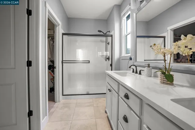 a kitchen with a sink and refrigerator