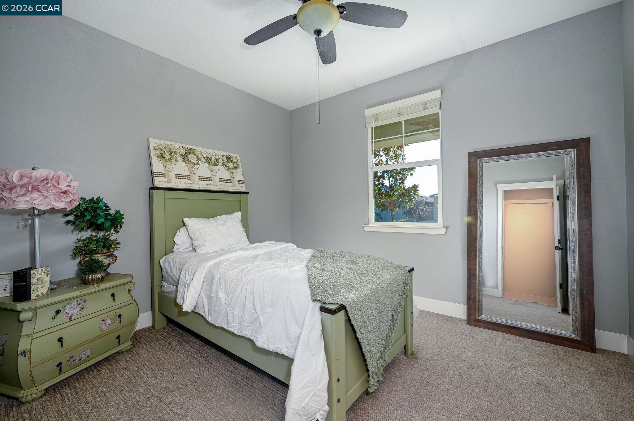 5245 Medea Way Antioch, CA 94531 - Photo 15 of 28 a bedroom with a bed and a chandelier