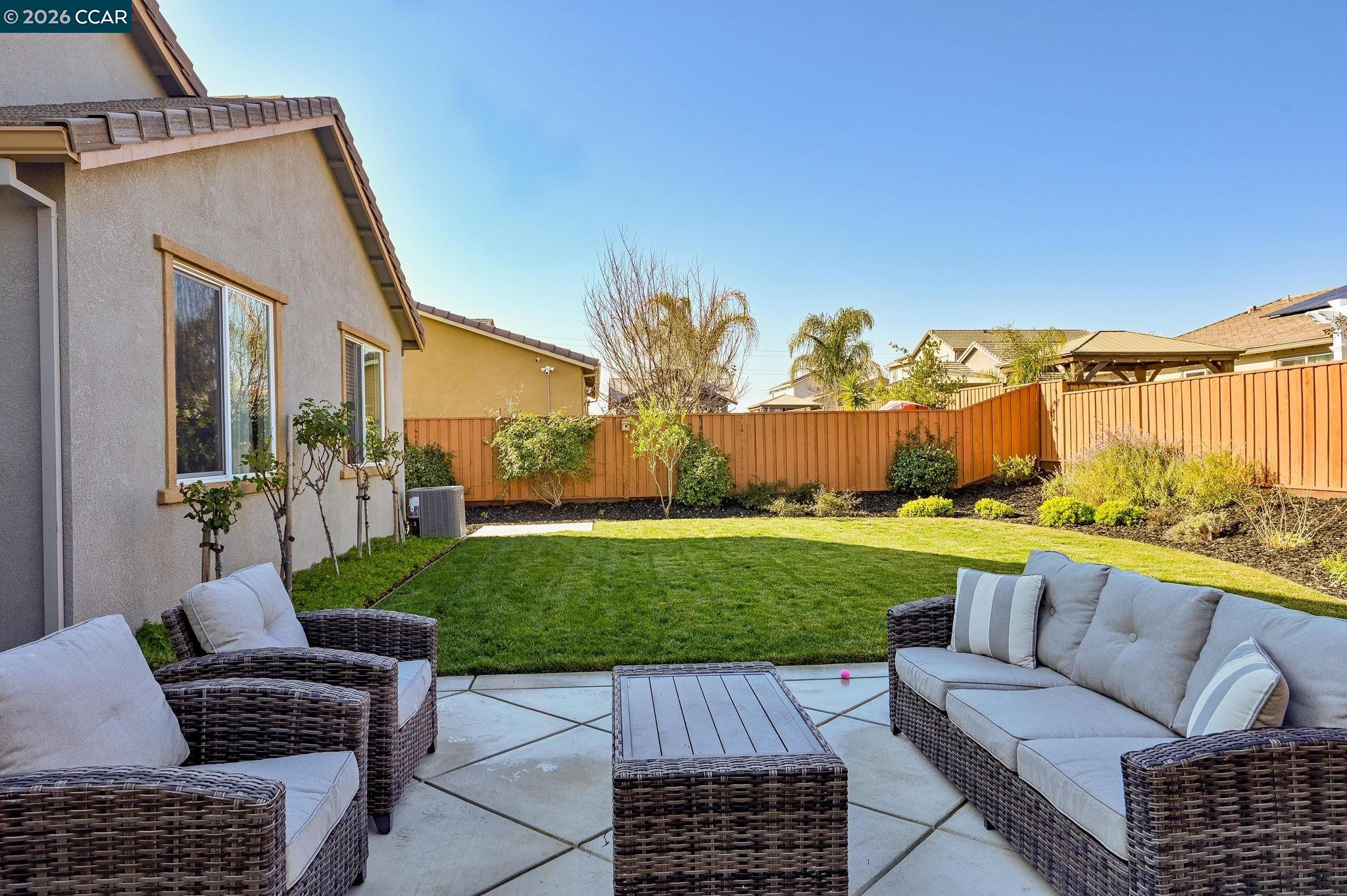 5245 Medea Way Antioch, CA 94531 - Photo 17 of 28 a view of a patio with couches chairs potted plants and a yard