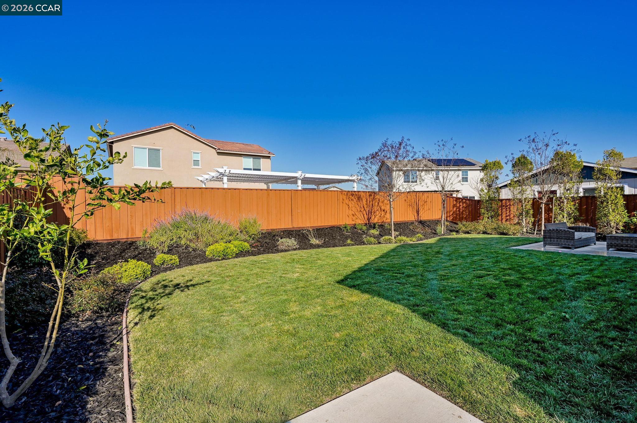 5245 Medea Way Antioch, CA 94531 - Photo 22 of 28 a view of a big house with a big yard and large trees