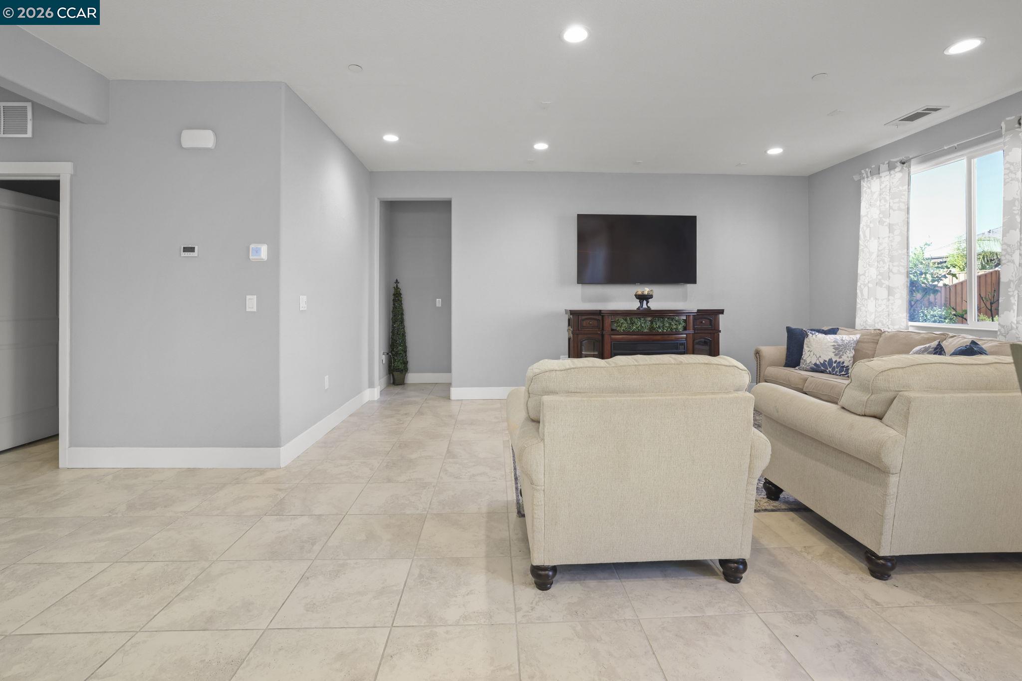 5245 Medea Way Antioch, CA 94531 - Photo 9 of 28 a living room with furniture and a flat screen tv