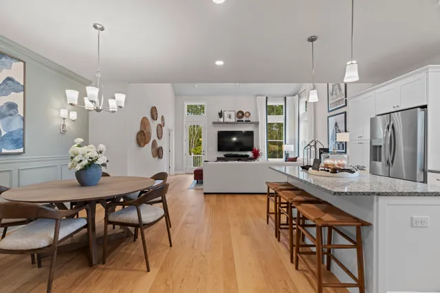 a view of a kitchen area kitchen island dining table and chairs
