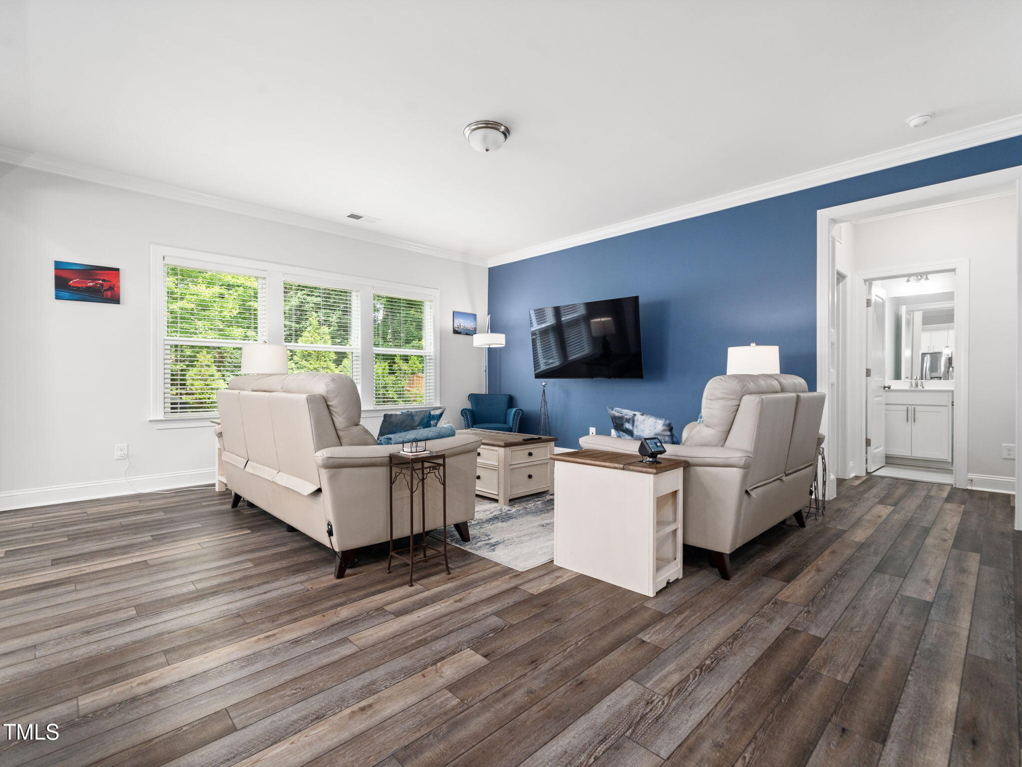 3213 Douglas Fir Road Raleigh, NC 27616 - Photo 11 of 44 a living room with furniture and flat screen tv