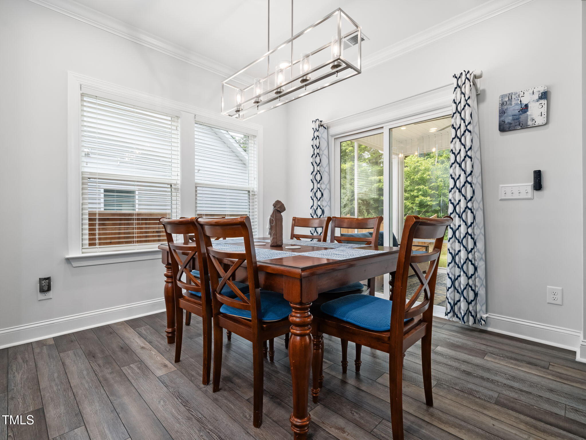 3213 Douglas Fir Road Raleigh, NC 27616 - Photo 15 of 44 a view of a dining room with furniture window and wooden floor