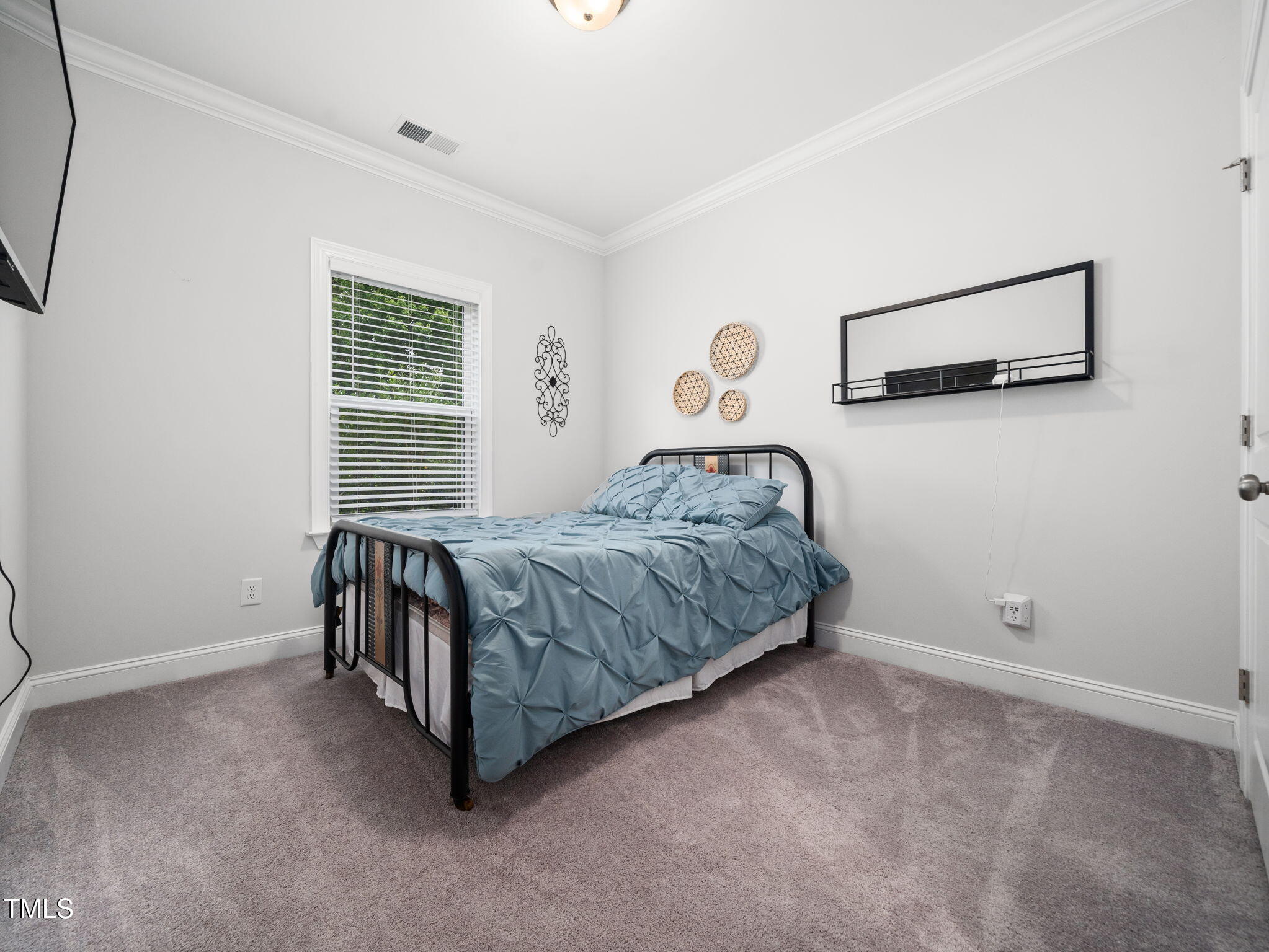 3213 Douglas Fir Road Raleigh, NC 27616 - Photo 22 of 44 a bedroom with a bed and a window