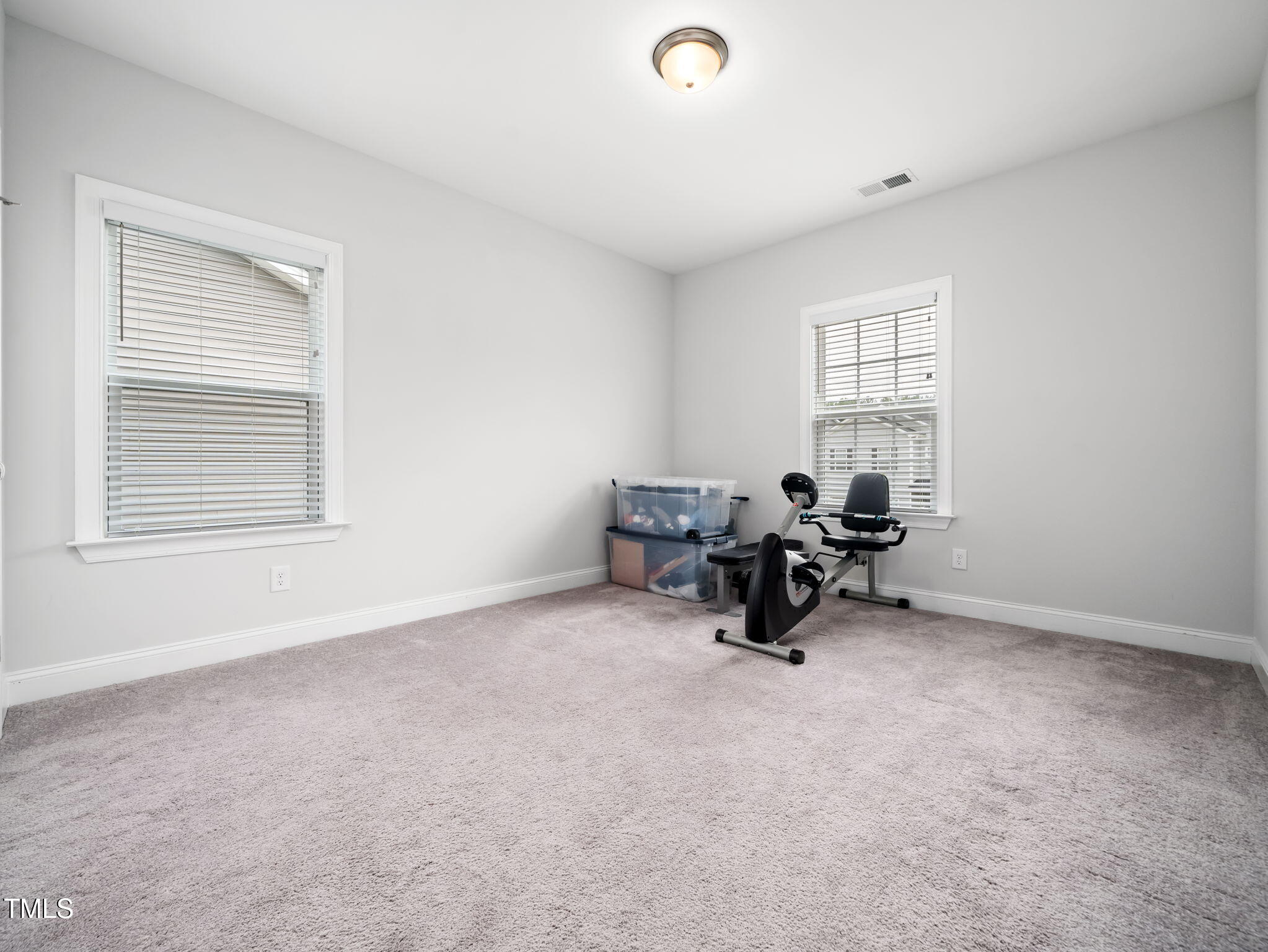 3213 Douglas Fir Road Raleigh, NC 27616 - Photo 23 of 44 a view of a livingroom with workspace and a window