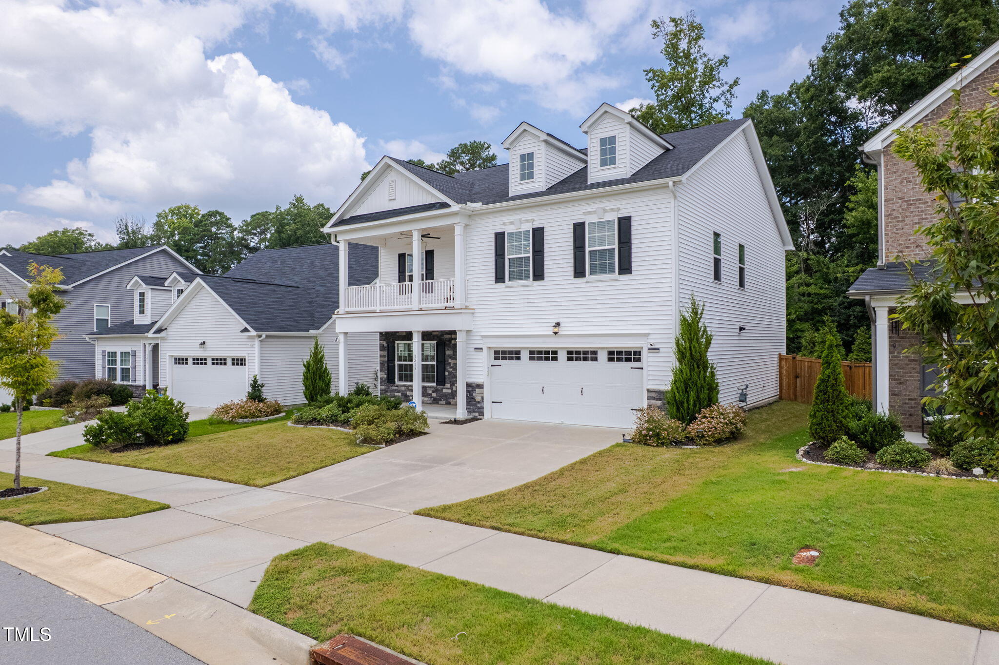 3213 Douglas Fir Road Raleigh, NC 27616 - Photo 40 of 44 a front view of a house with a yard and garage
