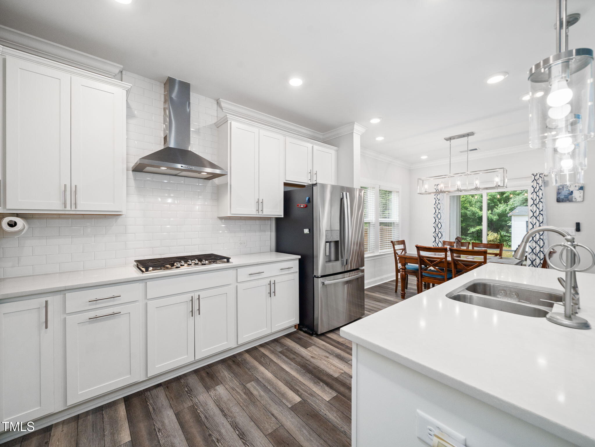 3213 Douglas Fir Road Raleigh, NC 27616 - Photo 4 of 44 a kitchen with stainless steel appliances a sink stove and refrigerator