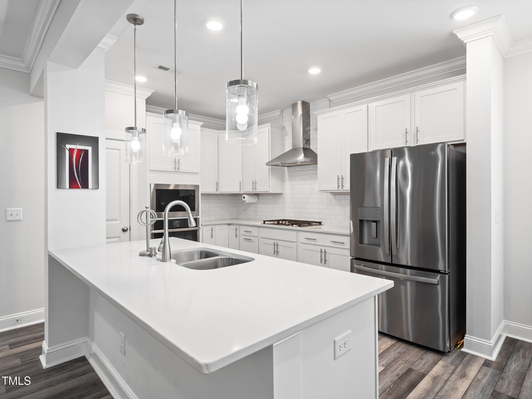 3213 Douglas Fir Road Raleigh, NC 27616 - Photo 6 of 44 a kitchen with kitchen island a counter space a sink appliances and cabinets