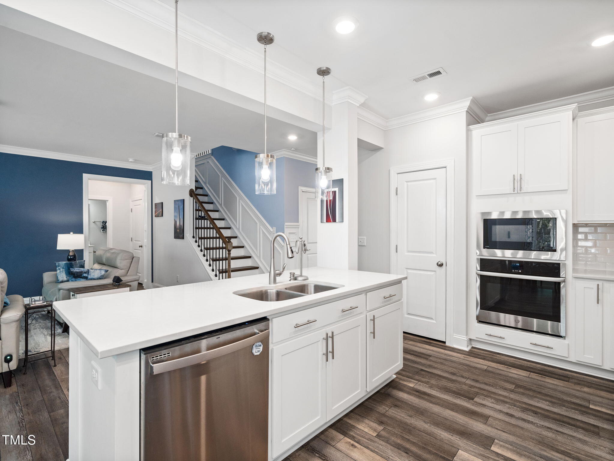 3213 Douglas Fir Road Raleigh, NC 27616 - Photo 8 of 44 a kitchen with a sink stainless steel appliances and cabinets