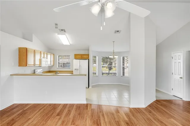 a view of kitchen and wooden floor