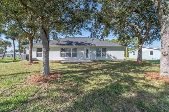a house view with a garden space