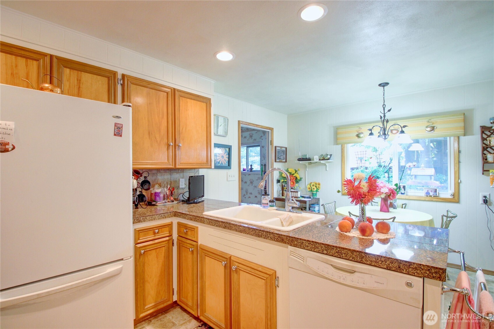2310 Alison Avenue Mount Vernon, WA 98273 - Photo 11 of 39 a kitchen with a sink refrigerator and cabinets