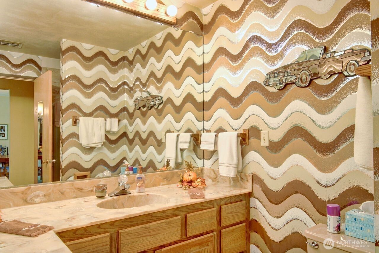 2310 Alison Avenue Mount Vernon, WA 98273 - Photo 25 of 39 a bathroom with a sink and a mirror