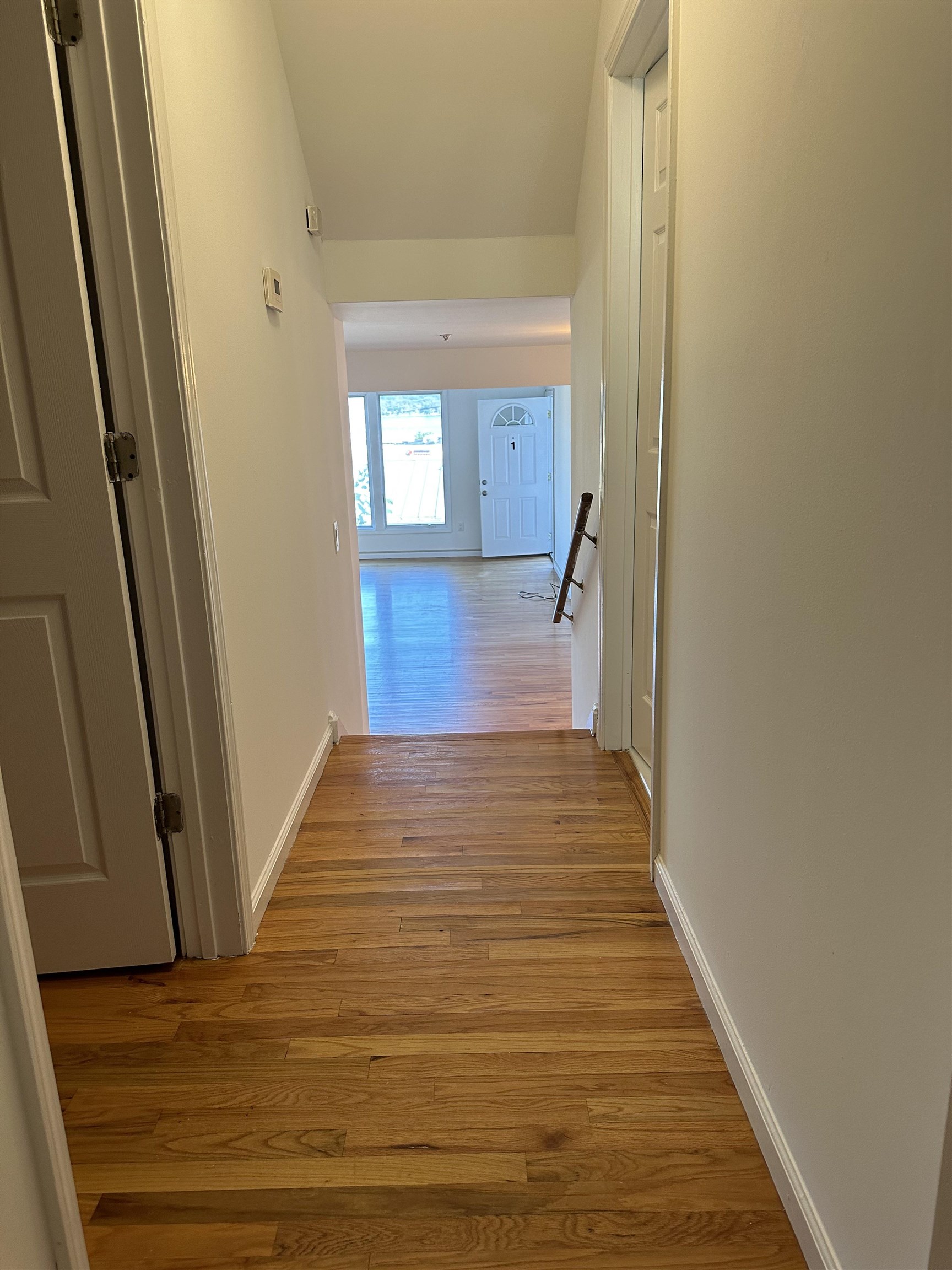 8911 Riverside Place, Unit 1 North Bergen, NJ 07047 - Photo 15 of 18 a view of a hallway with wooden floor and staircase