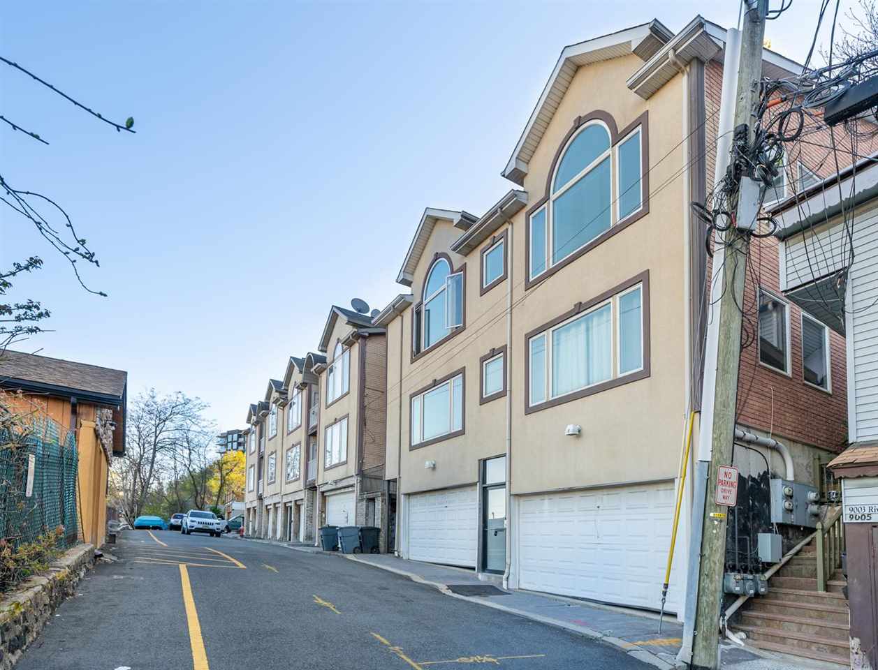 8911 Riverside Place, Unit 1 North Bergen, NJ 07047 - Photo 16 of 18 a view of a street with buildings