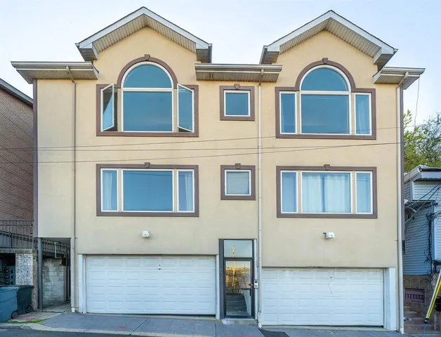 a front view of a house with a garage