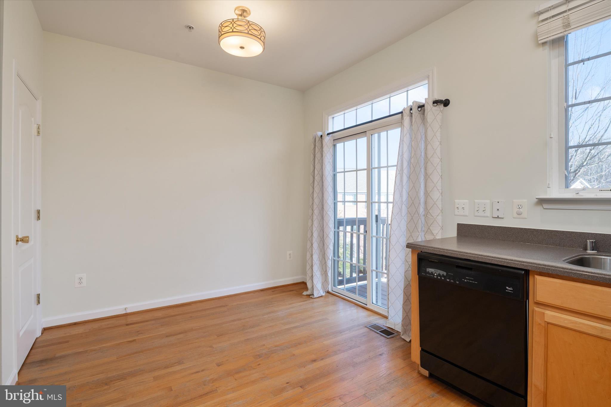 8129 Mississippi Road Laurel, MD 20724 - Photo 14 of 34 Sliders off eat in kitchen to deck!