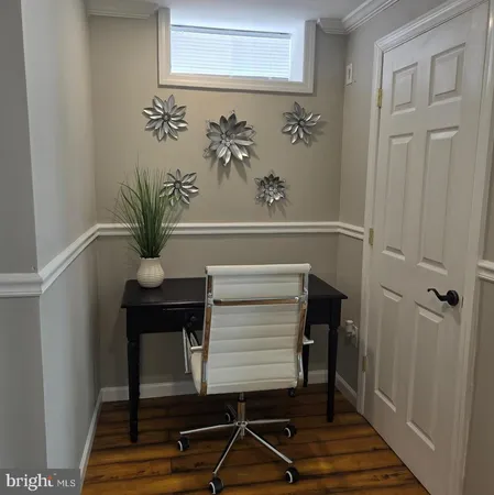 a view of entryway with wooden floor