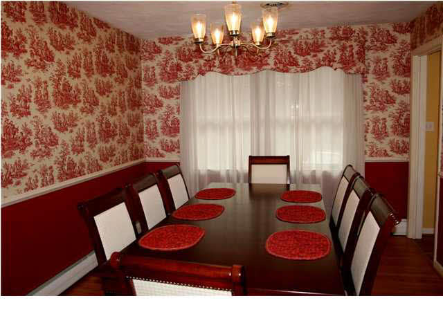 118 Alderman Road Charlottesville, VA 22903 - Photo 7 of 16 a living room with furniture and a chandelier