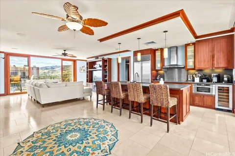a living room with lots of furniture and a chandelier
