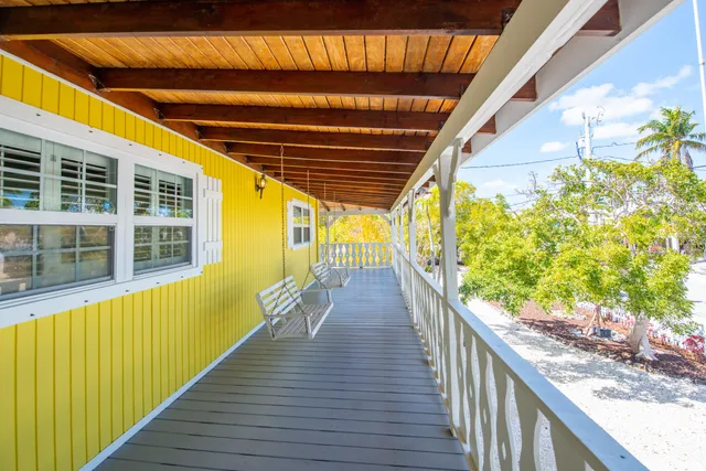 a view of balcony with wooden floor