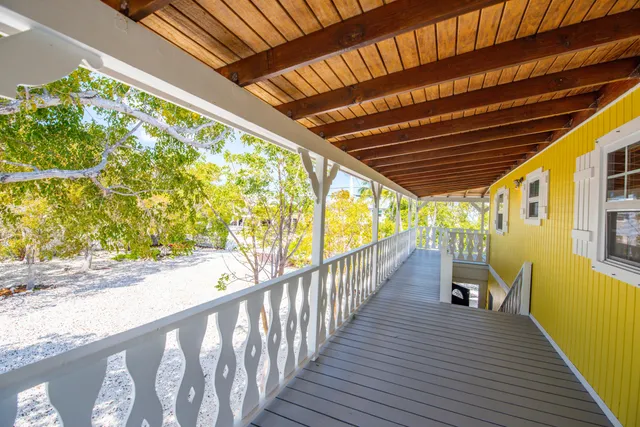 a view of a balcony with wooden floor