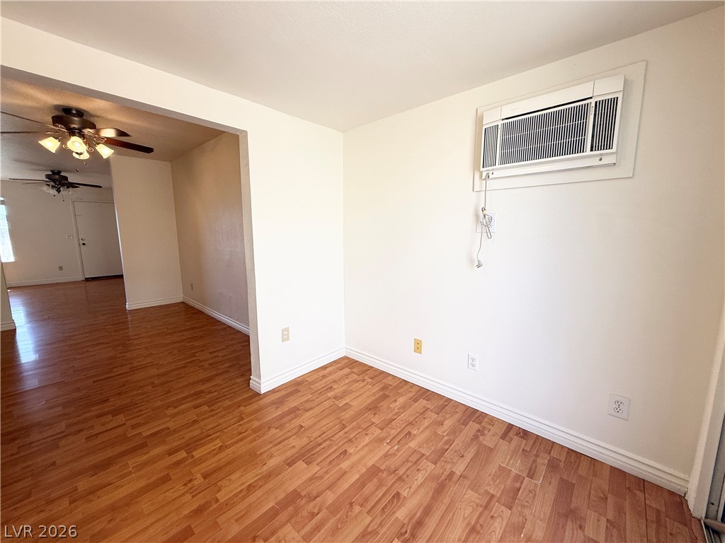 616 Greenway Road Henderson, NV 89002 - Photo 10 of 32 Rich hardwood floors flow through this welcoming living space.