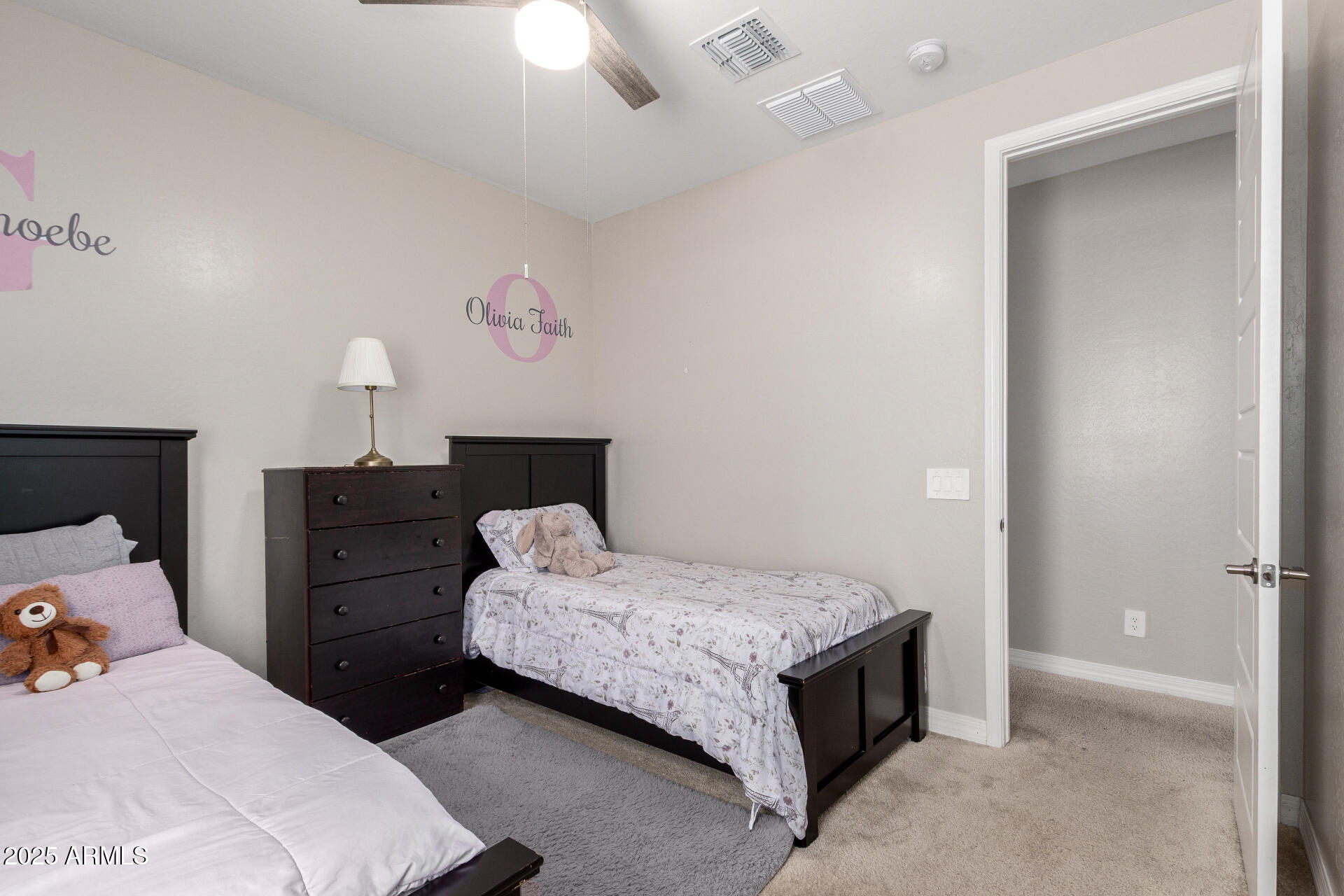 10029 East Tahoe Avenue Mesa, AZ 85212 - Photo 20 of 52 a bedroom with a bed and a chandelier