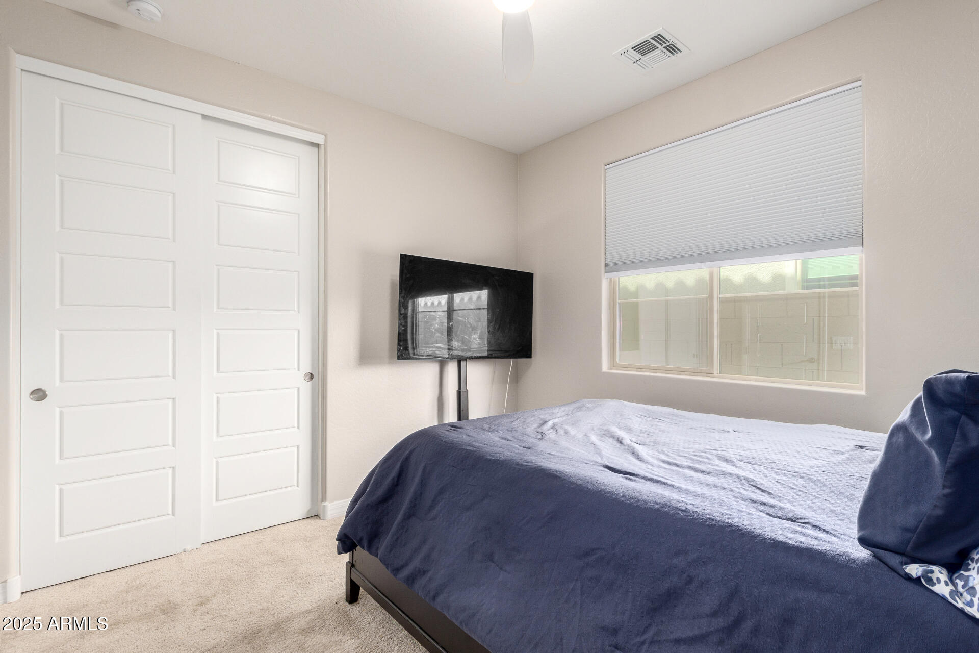 10029 East Tahoe Avenue Mesa, AZ 85212 - Photo 23 of 52 a bedroom with a bed and a window