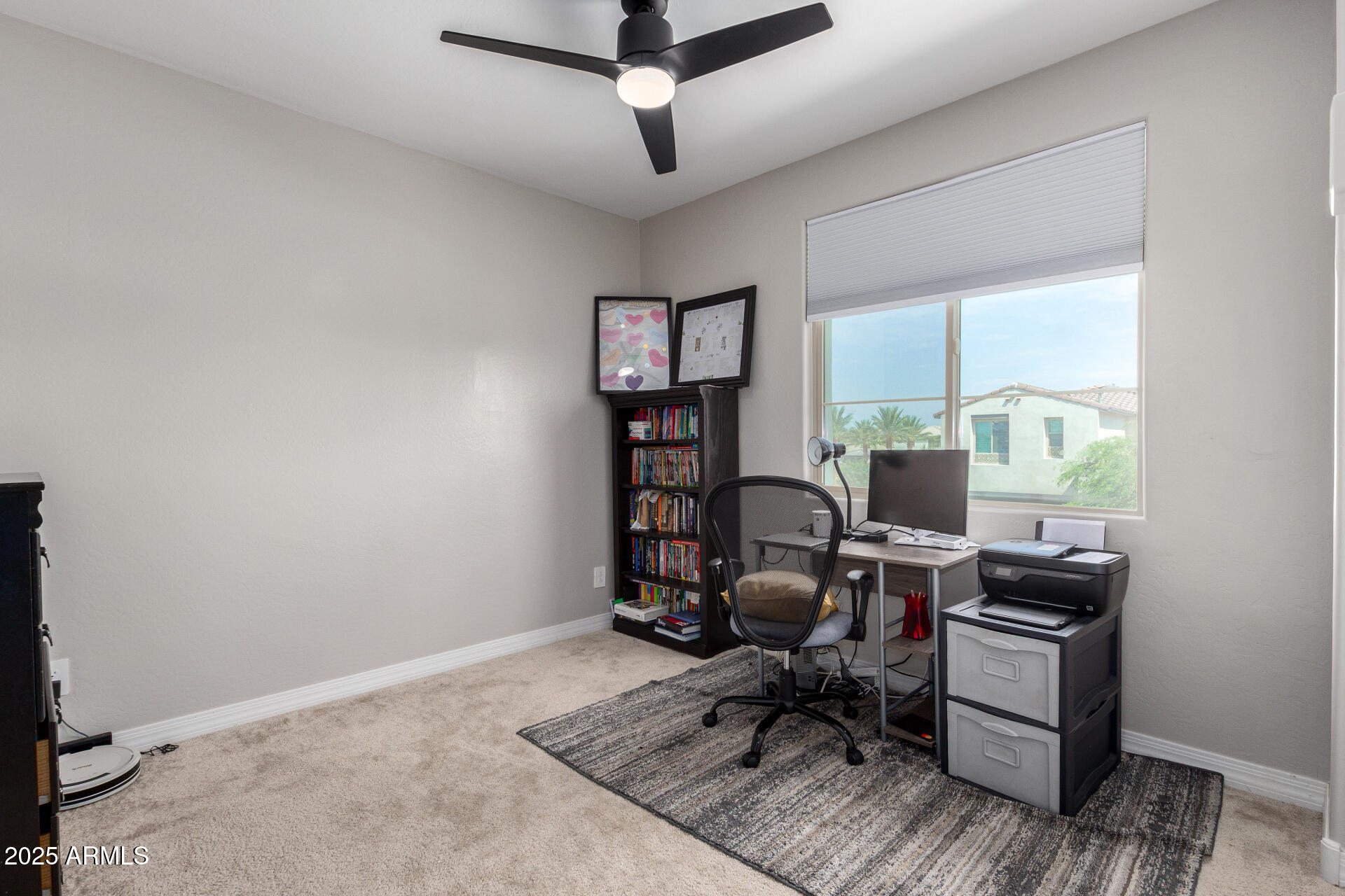 10029 East Tahoe Avenue Mesa, AZ 85212 - Photo 24 of 52 a view of a workspace with furniture and a window