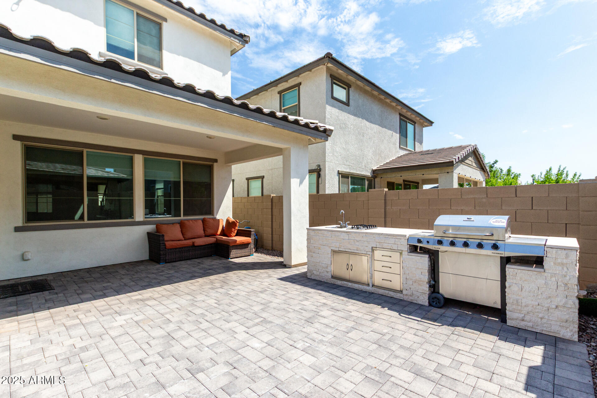 10029 East Tahoe Avenue Mesa, AZ 85212 - Photo 28 of 52 a view of a white house with a large windows