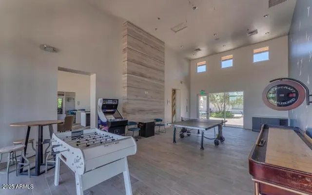 a room with gym equipment and windows