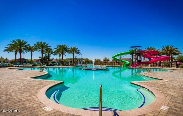 a view of swimming pool from a balcony