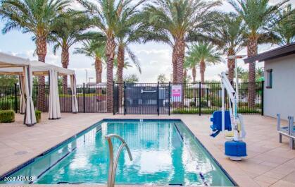 10029 East Tahoe Avenue Mesa, AZ 85212 - Photo 46 of 52 a swimming pool with outdoor seating and yard