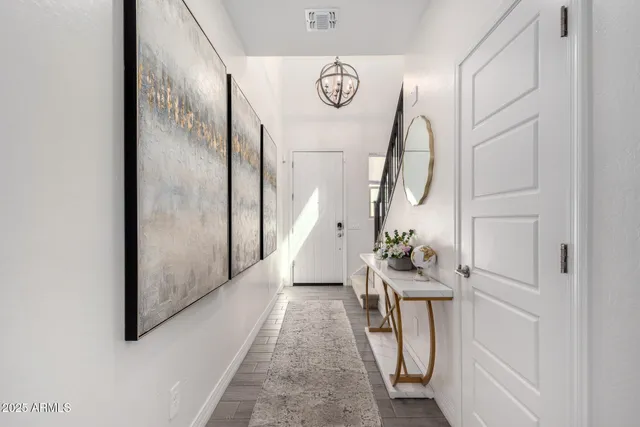 a view of an entryway with wooden floor