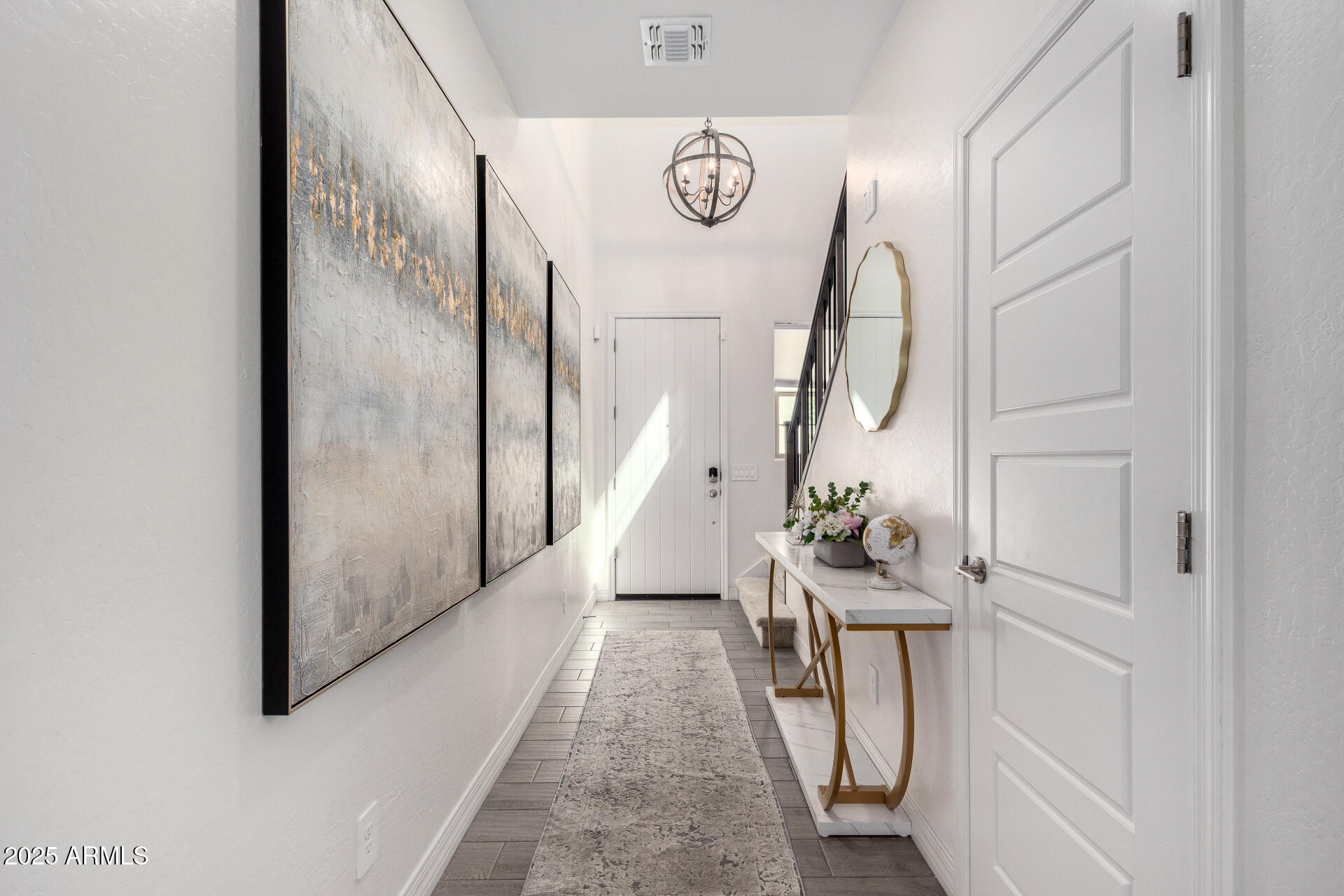10029 East Tahoe Avenue Mesa, AZ 85212 - Photo 5 of 52 a view of an entryway with wooden floor