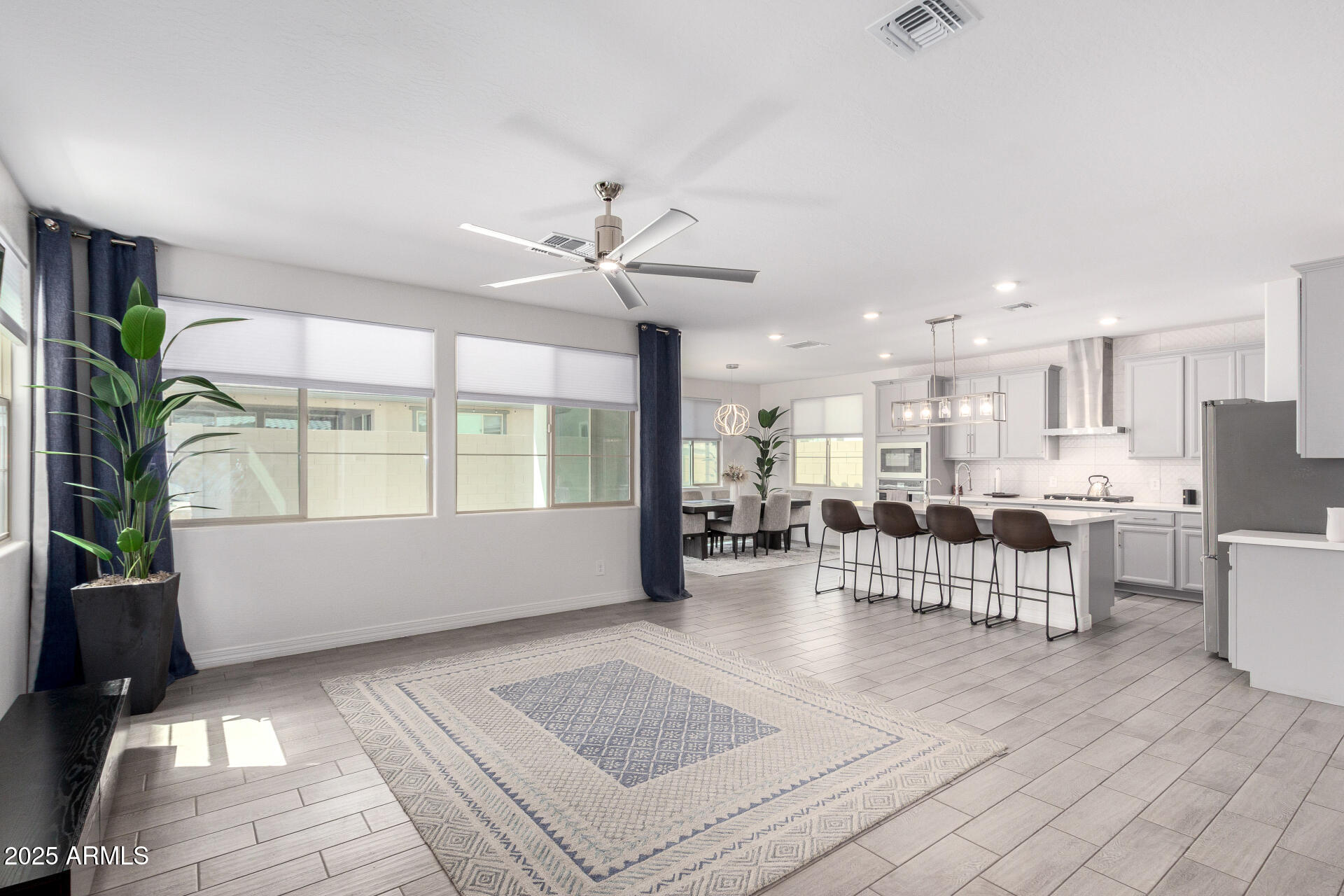 10029 East Tahoe Avenue Mesa, AZ 85212 - Photo 8 of 52 a living room with furniture and a large window