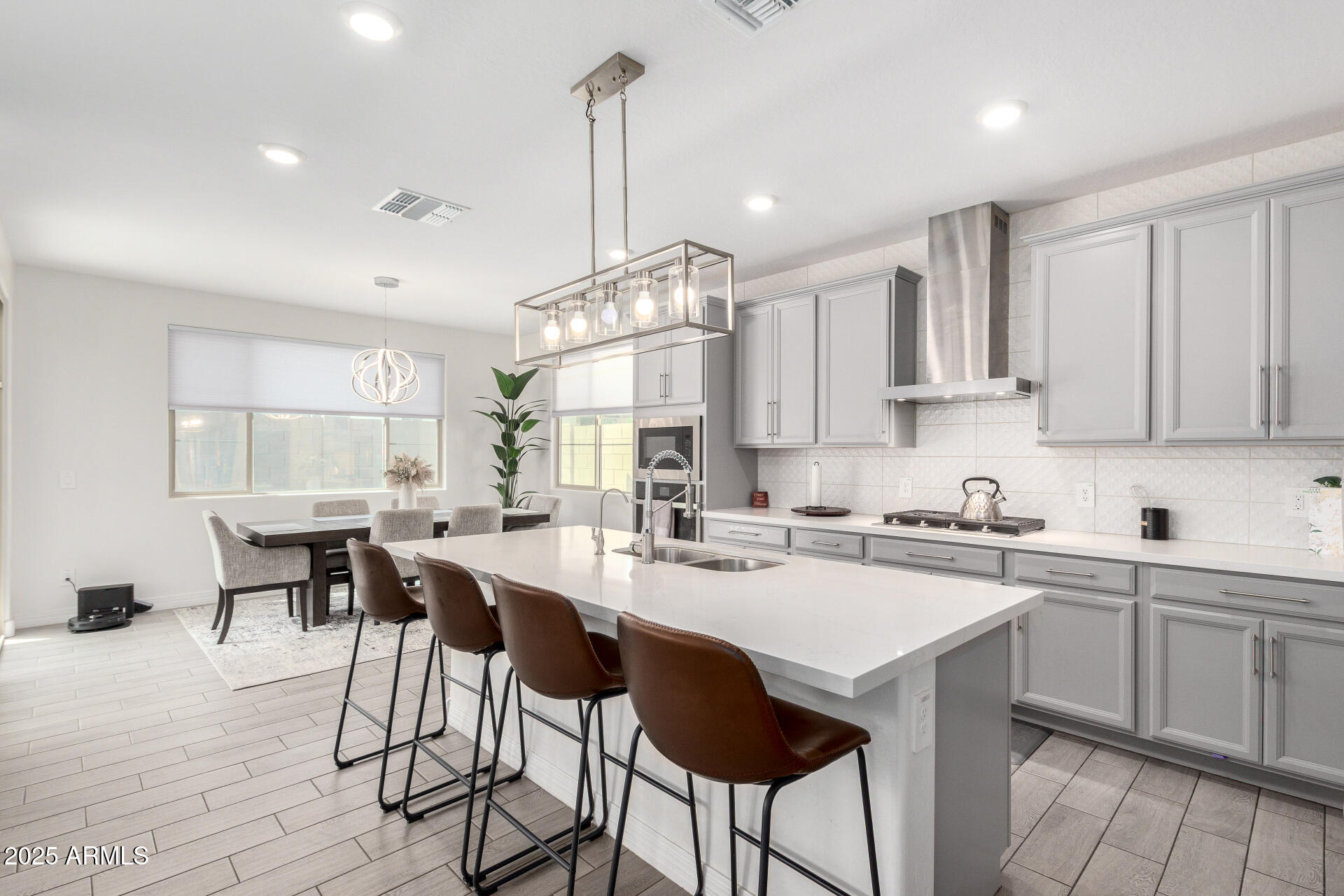 10029 East Tahoe Avenue Mesa, AZ 85212 - Photo 10 of 52 a kitchen with a sink a counter space appliances and cabinets