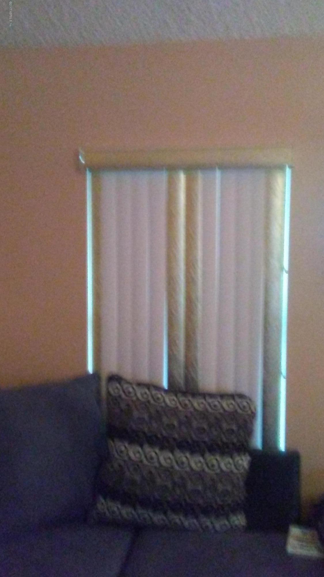 8906 Sibbald Road Jacksonville, FL 32208 - Photo 9 of 10 window covering