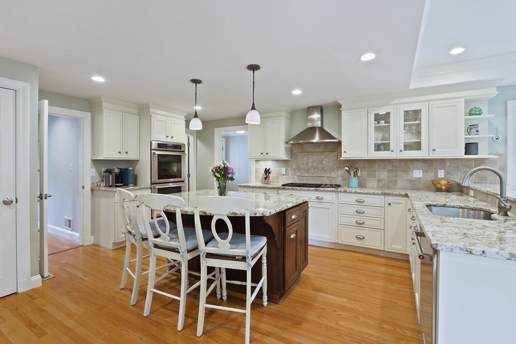60 Colby Street Needham, MA 02492 - Photo 12 of 41 a kitchen with stainless steel appliances kitchen island granite countertop a kitchen island hardwood floor and a sink