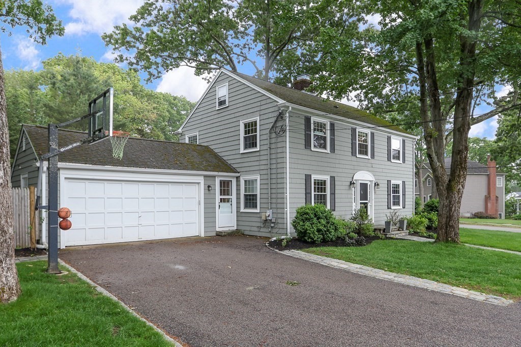60 Colby Street Needham, MA 02492 - Photo 2 of 41 a front view of a house with a yard and garage
