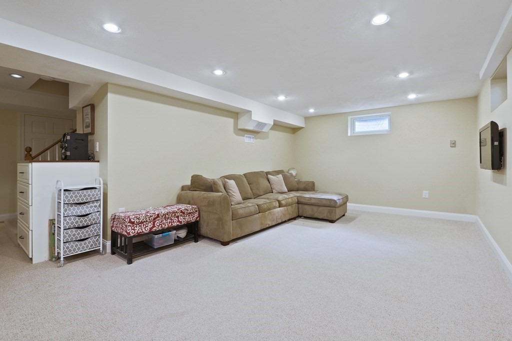 60 Colby Street Needham, MA 02492 - Photo 34 of 41 a living room with furniture and a flat screen tv