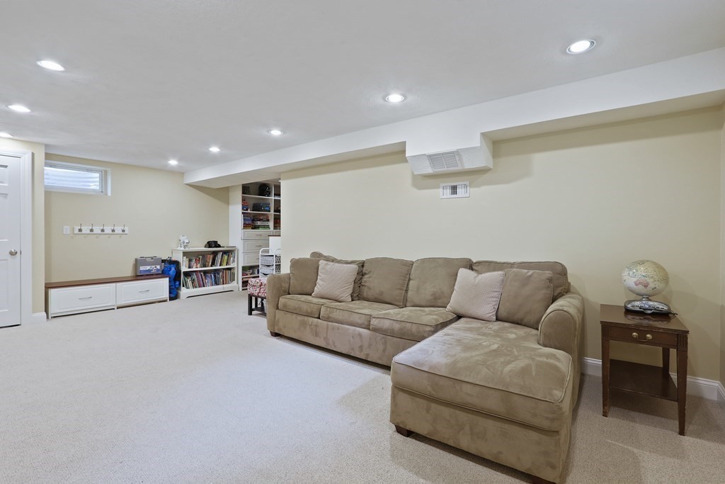 60 Colby Street Needham, MA 02492 - Photo 35 of 41 a living room with furniture and a couch