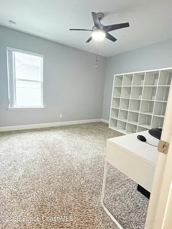 a view of a room with a sink and a window
